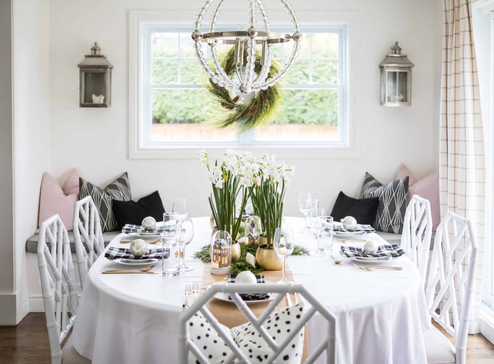 Modern dining room containing flowers in the middle of the table
