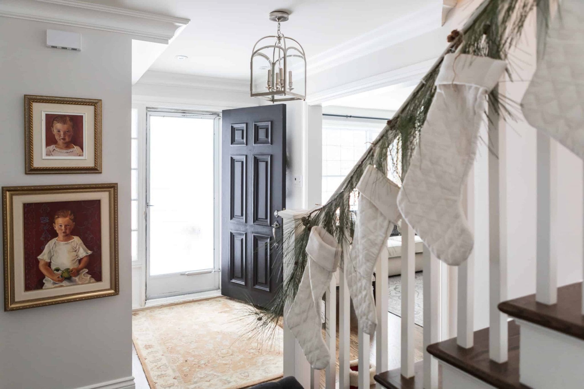 Modern staircase with white Christmas stocking's hanging of the railing