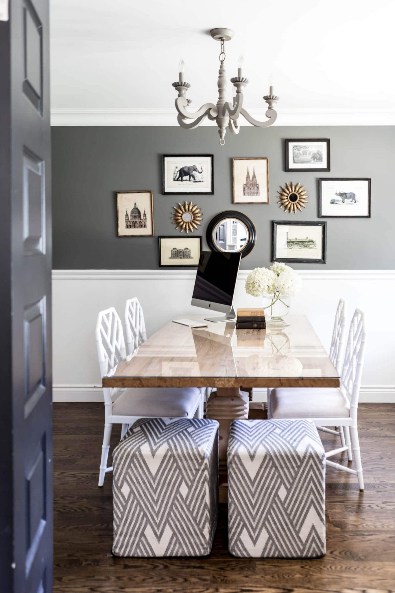 Black and white dinning room with pictures of animals on the wall